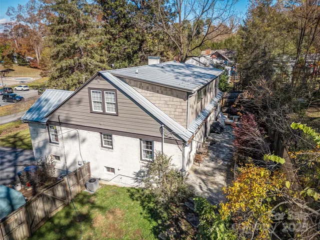 a house view with a wooden fencing