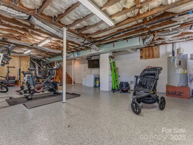 a view of a backyard with chairs and a fire pit