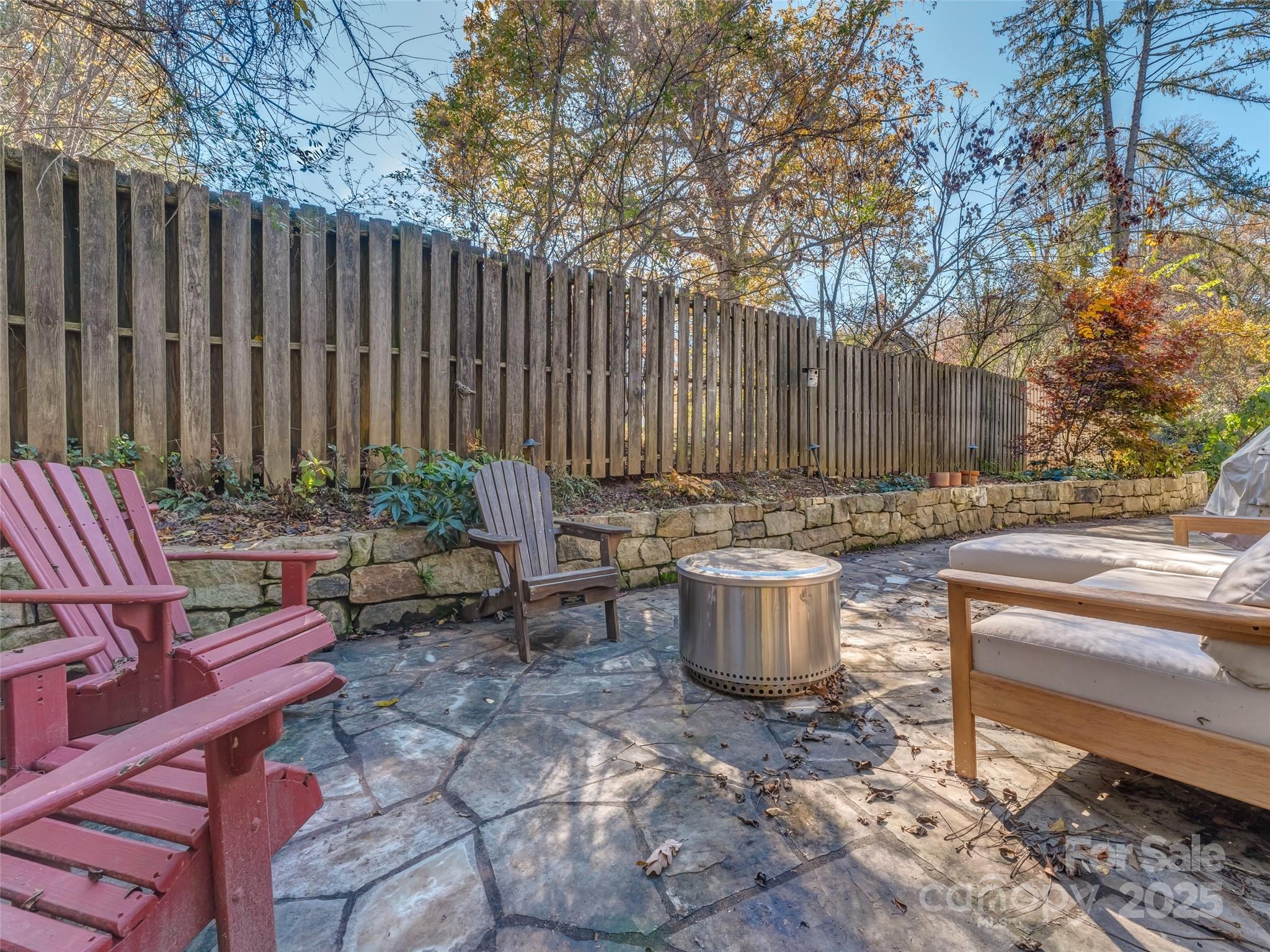 140 Lakeview Avenue Brevard, NC 28712 - Photo 35 of 37 a view of a backyard with chairs and a fire pit