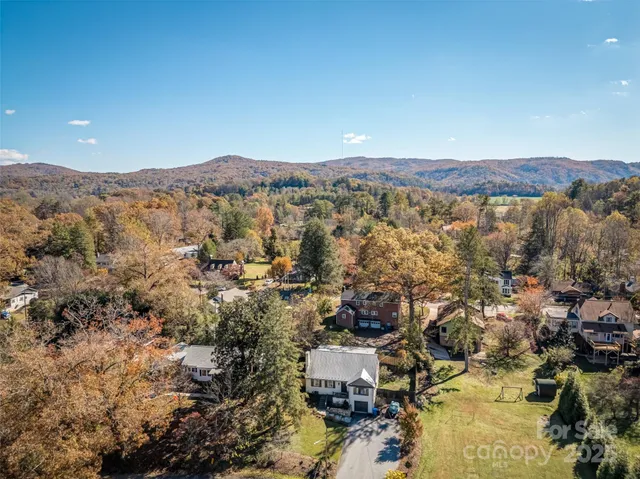 an aerial view of residential house and sandy dunes