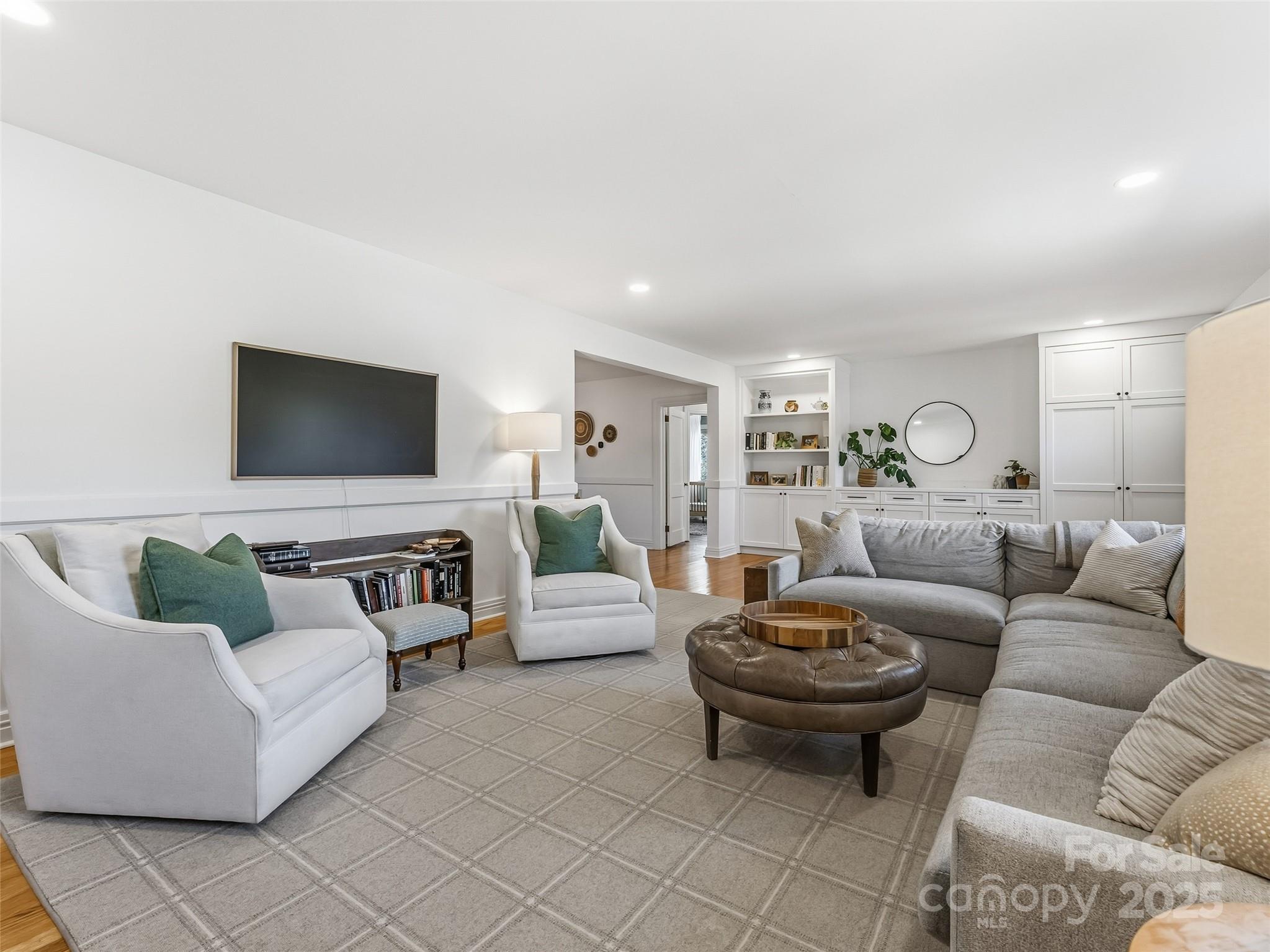 140 Lakeview Avenue Brevard, NC 28712 - Photo 7 of 37 a living room with furniture and a flat screen tv