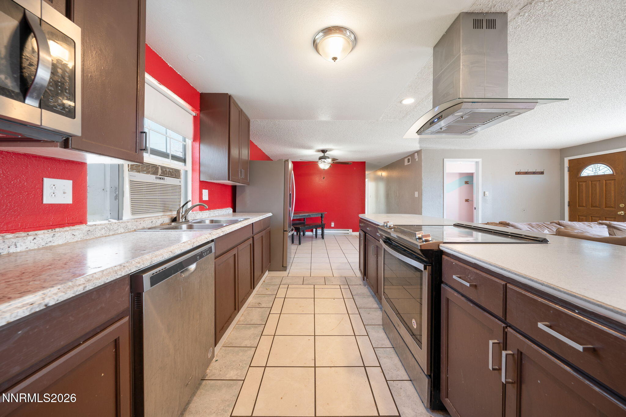 3590 Siskin Lane Reno, NV 89508 - Photo 11 of 31 a large kitchen with stainless steel appliances granite countertop lots of counter top space