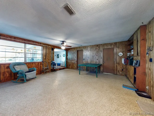 a kitchen with stainless steel appliances a refrigerator sink and cabinets