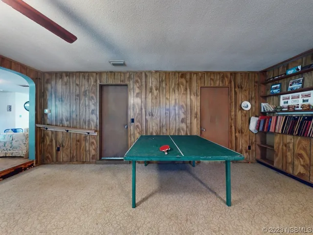 a kitchen with white cabinets and sink
