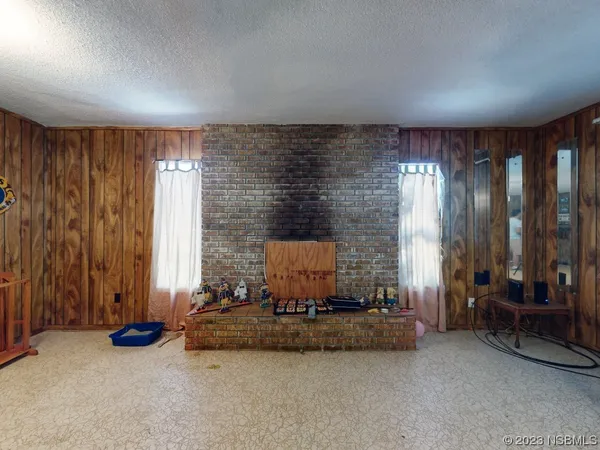 a kitchen with granite countertop a sink appliances cabinets and a window