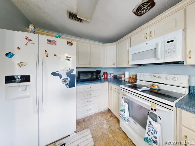a living room with furniture a window and gym equipment