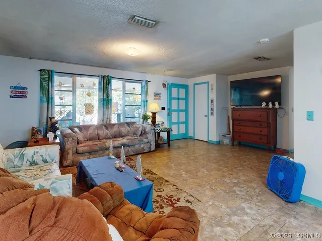 a bed room with a bed and a large mirror