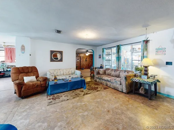 a living room with furniture and a window