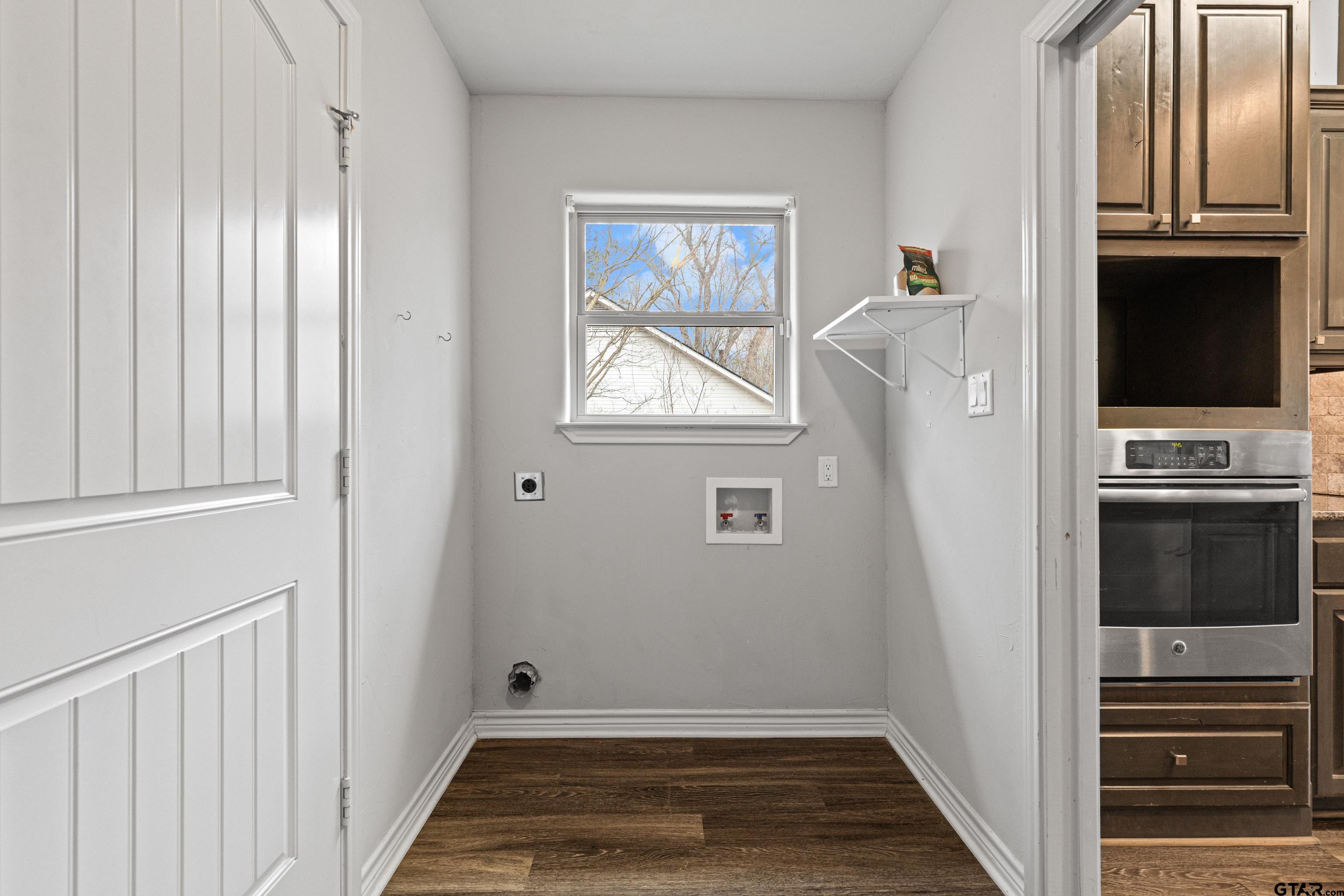 302 Collins Avenue Longview, TX 75605 - Photo 2 of 36 a view of hallway with stairs and wooden floor