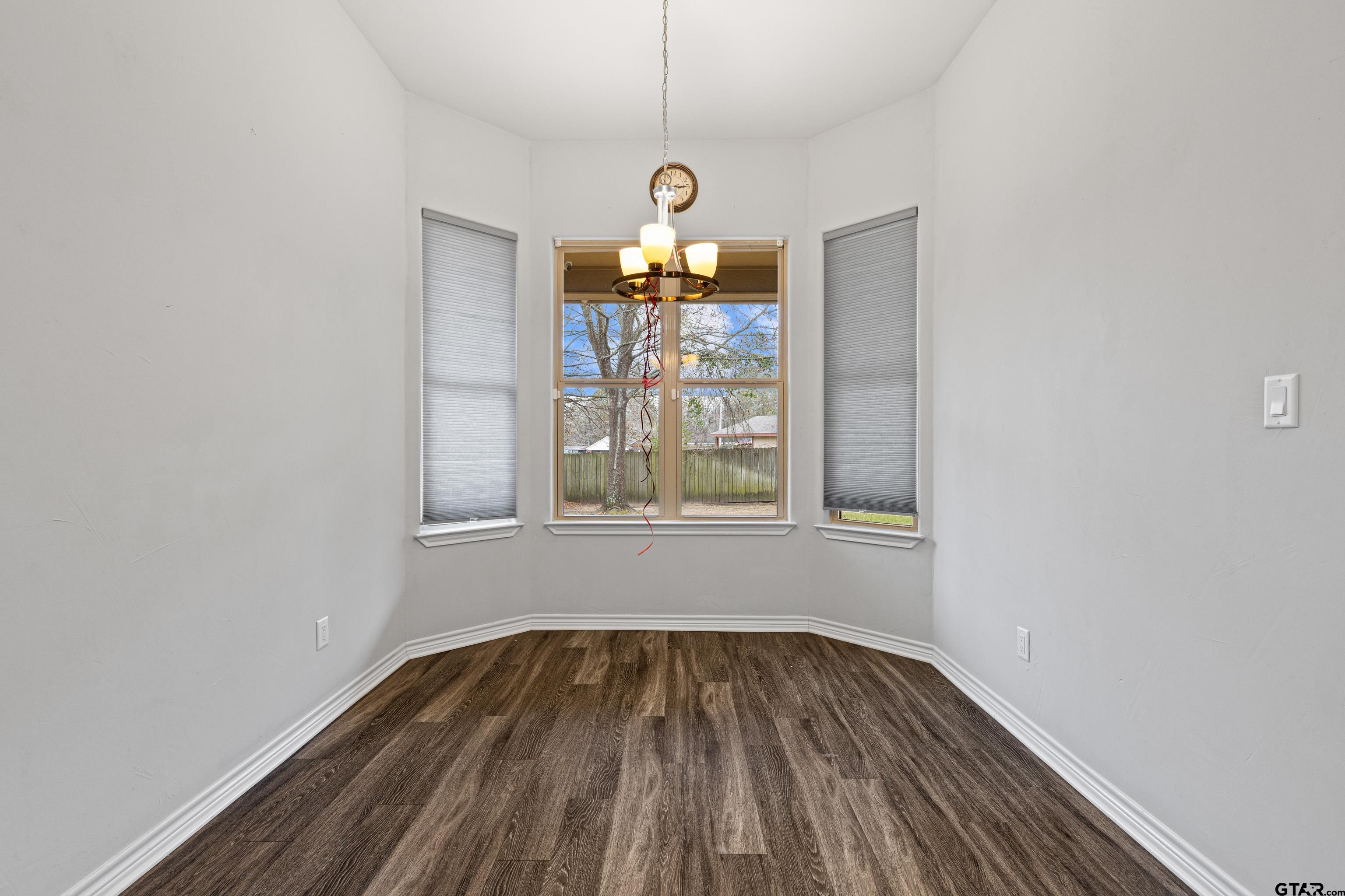 302 Collins Avenue Longview, TX 75605 - Photo 25 of 36 a view of a room with wooden floor fan and window