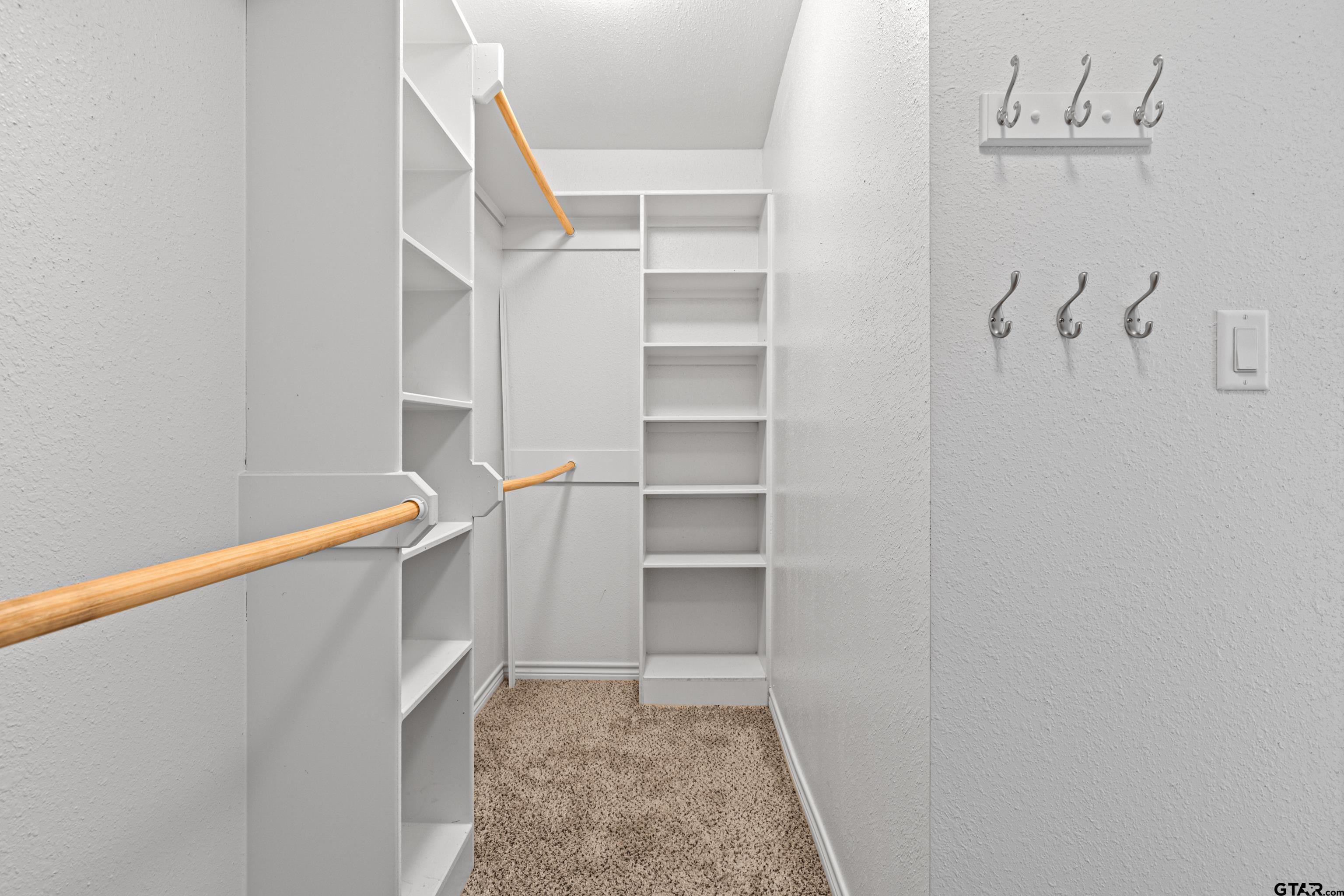 302 Collins Avenue Longview, TX 75605 - Photo 9 of 36 a view of walk in closet with empty racks