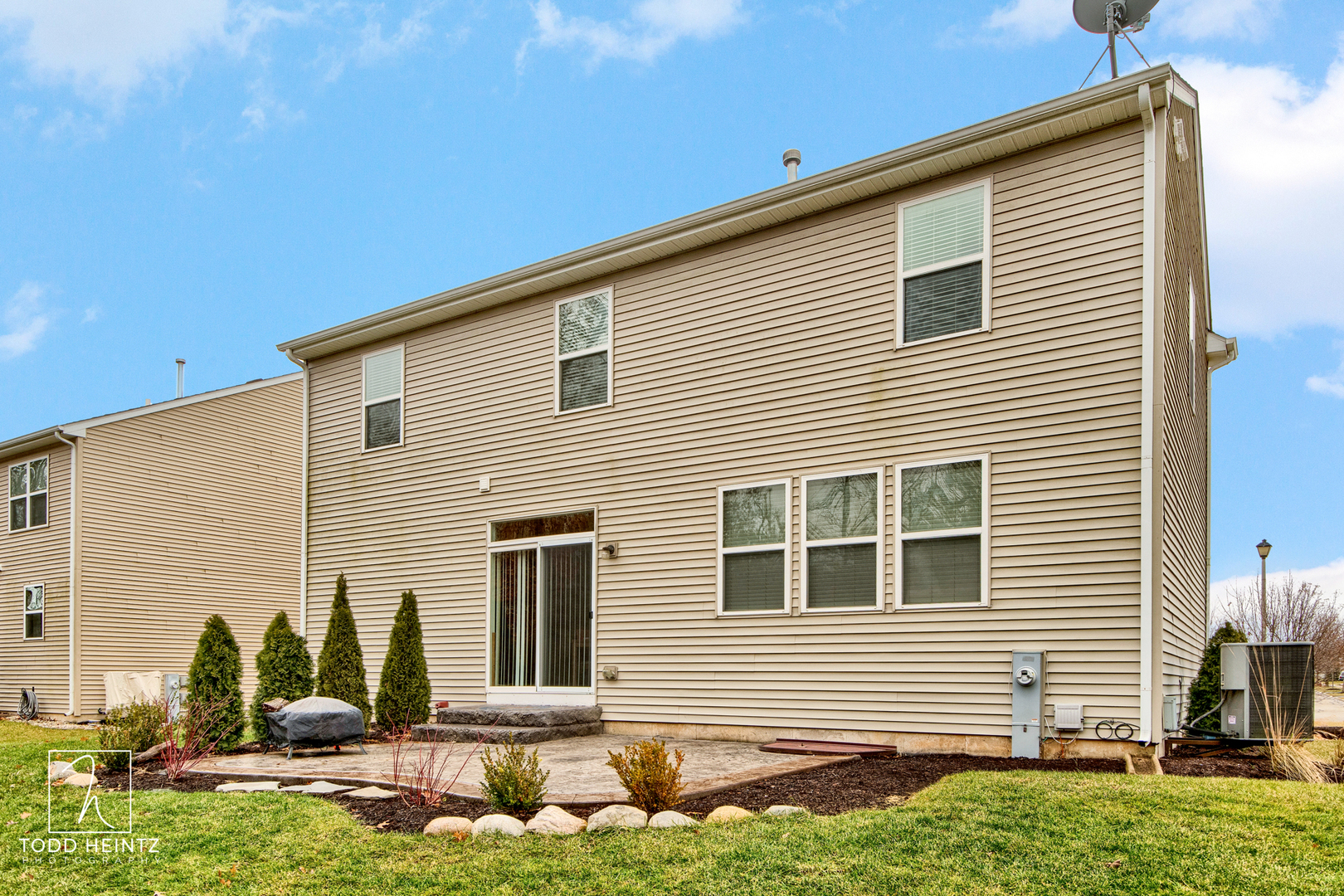 1916 Roger Road Woodstock, IL 60098 - Photo 22 of 24 a front view of a house with garden