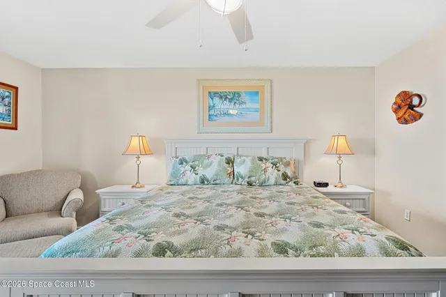 a bedroom with a bed and a view of walk in closet