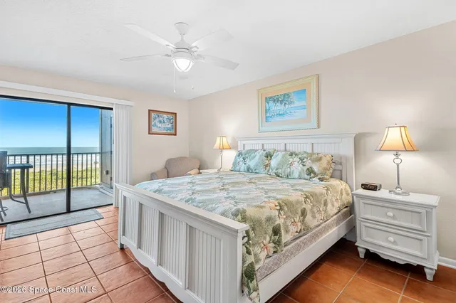 a view of a bedroom with a balcony