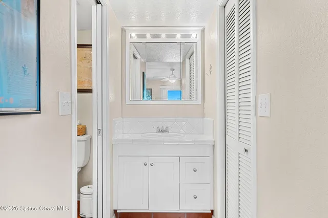 a view of a balcony with furniture