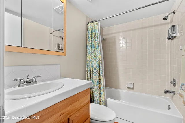 a bathroom with a sink a toilet and a bathtub