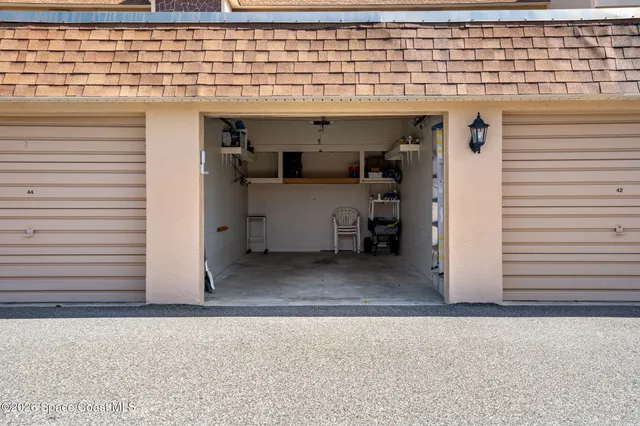 a view of swimming pool with outdoor seating and plants