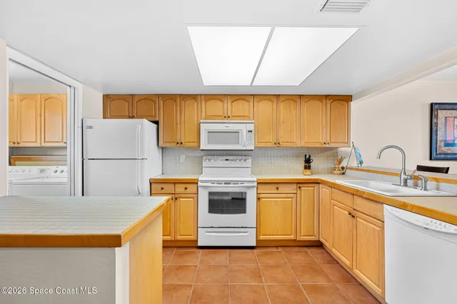 a utility room with cabinets
