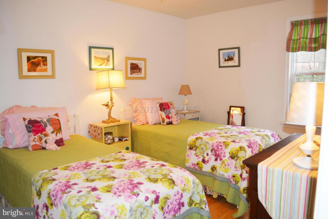 66 Sandyhook Road Ocean Pines, MD 21811 - Photo 12 of 18 a bedroom with a bed and a dresser