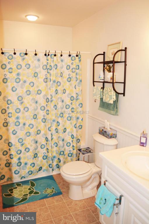 66 Sandyhook Road Ocean Pines, MD 21811 - Photo 14 of 18 a bathroom with a sink toilet and shower