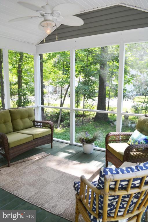 66 Sandyhook Road Ocean Pines, MD 21811 - Photo 16 of 18 a living room with furniture and a floor to ceiling window