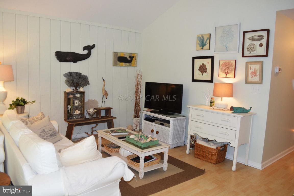 66 Sandyhook Road Ocean Pines, MD 21811 - Photo 6 of 18 a living room with furniture and a flat screen tv