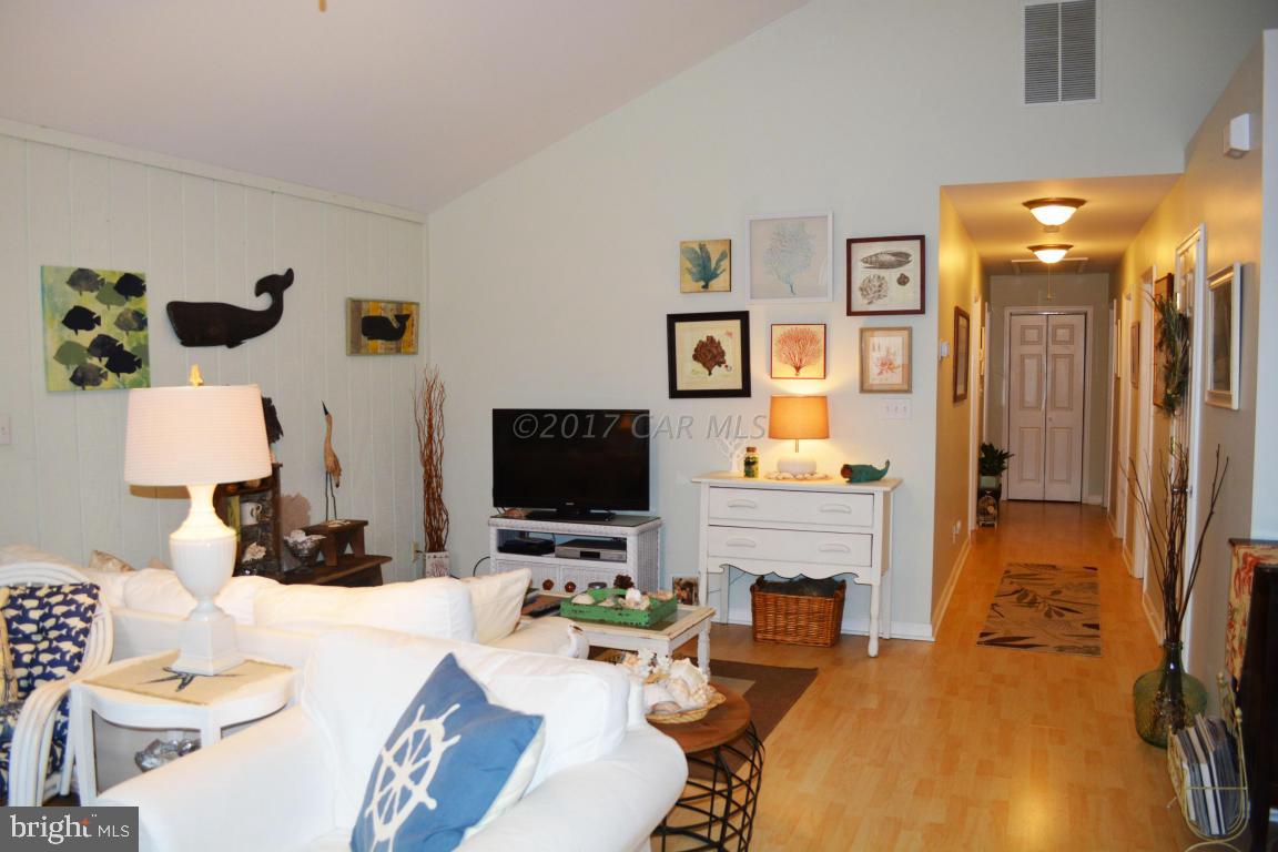 66 Sandyhook Road Ocean Pines, MD 21811 - Photo 7 of 18 a living room with furniture a flat screen tv and a view of kitchen
