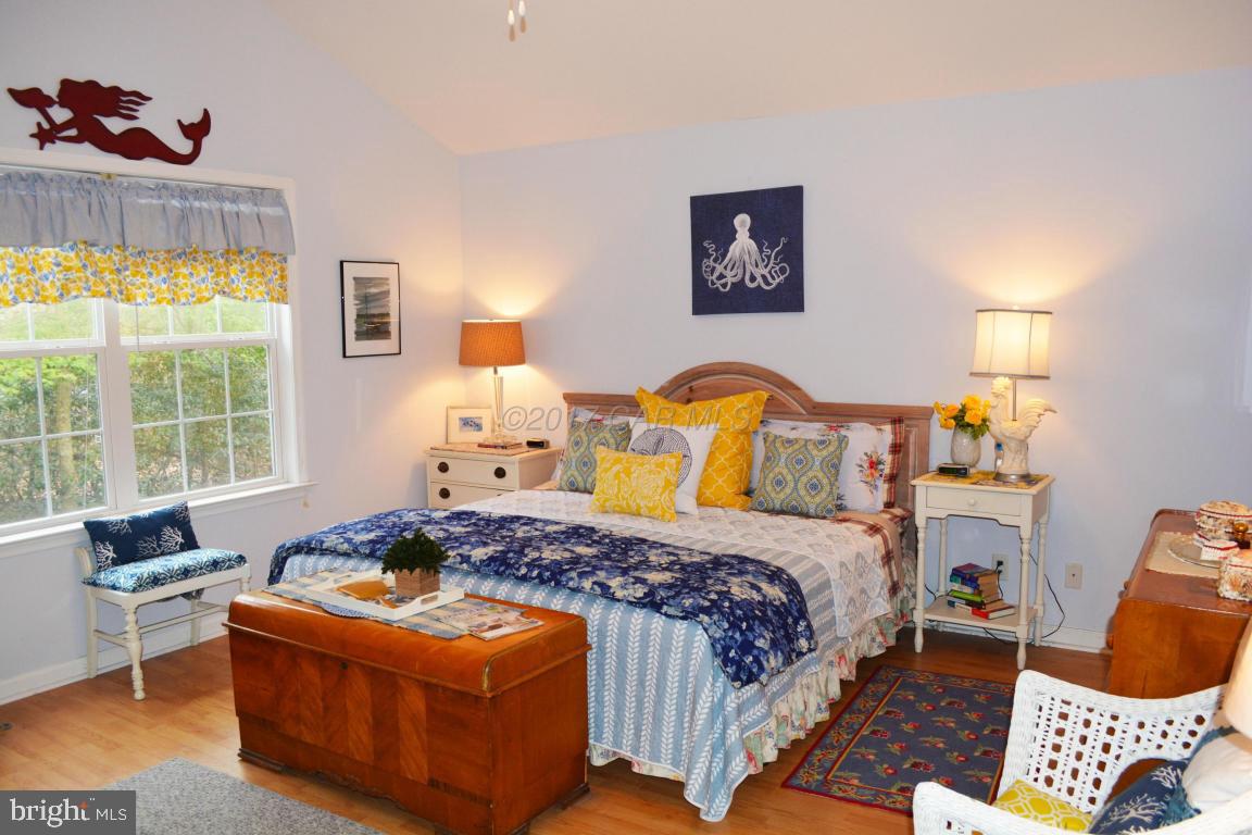 66 Sandyhook Road Ocean Pines, MD 21811 - Photo 8 of 18 a bedroom with a bed and a window
