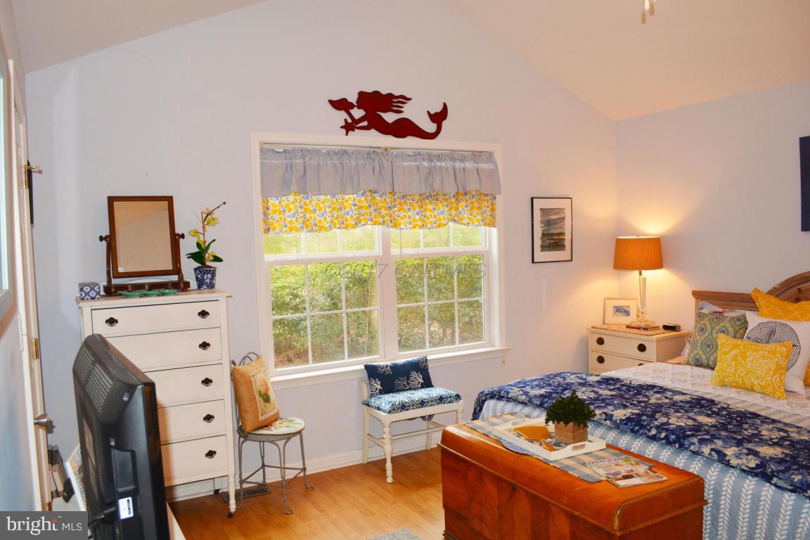 66 Sandyhook Road Ocean Pines, MD 21811 - Photo 9 of 18 a bedroom with furniture and a window