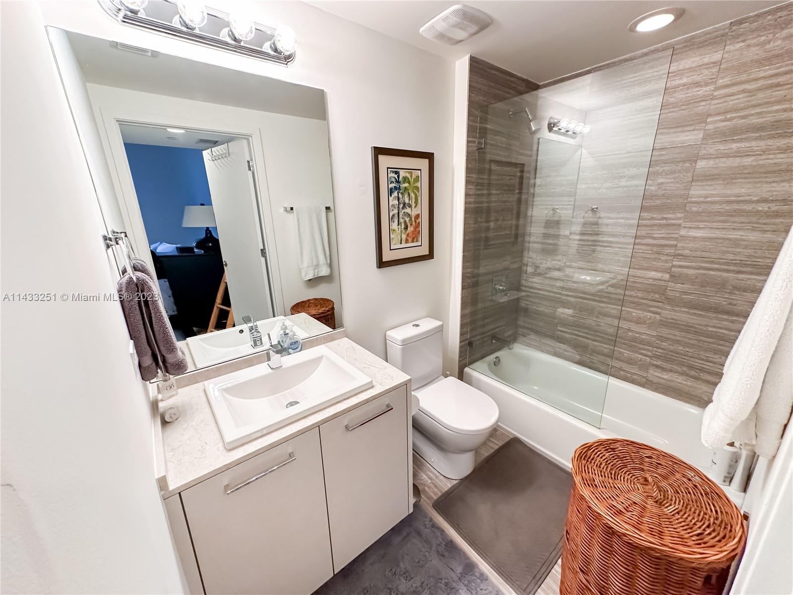 1010 Brickell Avenue, Unit 2505 Miami, FL 33131 - Photo 23 of 38 a bathroom with a sink toilet and shower
