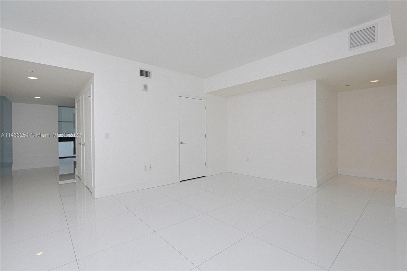 1010 Brickell Avenue, Unit 2505 Miami, FL 33131 - Photo 25 of 38 wooden floor in an empty room