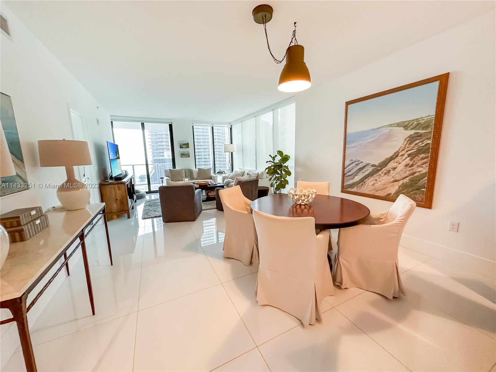 1010 Brickell Avenue, Unit 2505 Miami, FL 33131 - Photo 5 of 38 a view of a livingroom with furniture and a window