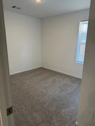 a bathroom with a shower sink mirror and toilet