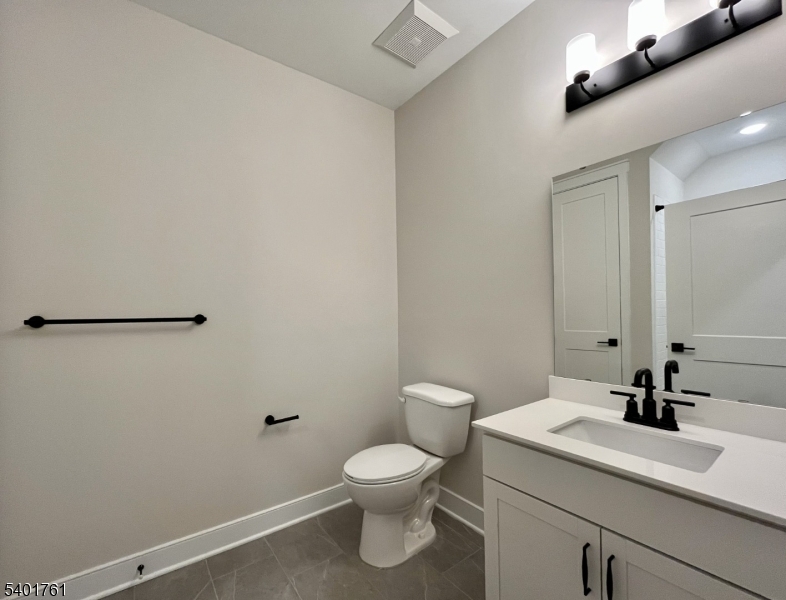 104 Myrtle Road Warren, NJ 07059 - Photo 23 of 26 a bathroom with a toilet a sink and mirror
