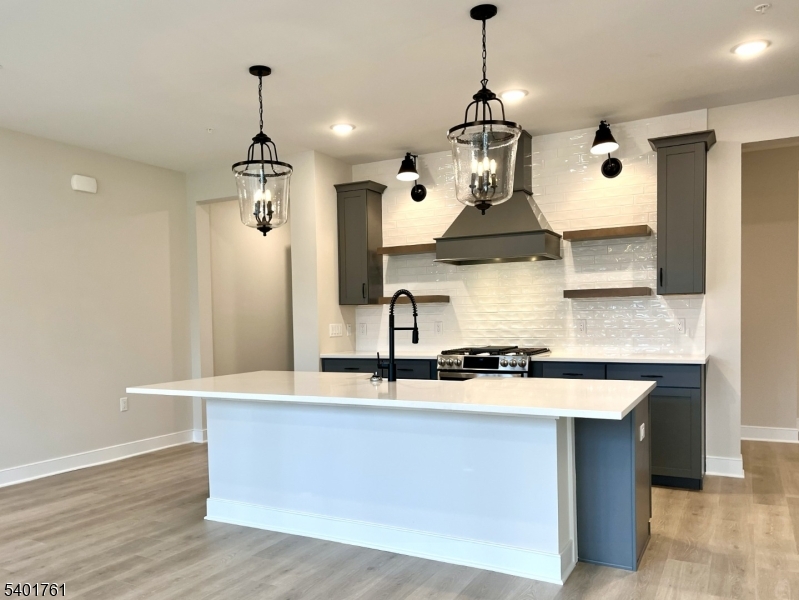 104 Myrtle Road Warren, NJ 07059 - Photo 5 of 26 a kitchen with stainless steel appliances granite countertop a sink a counter space and wooden floor