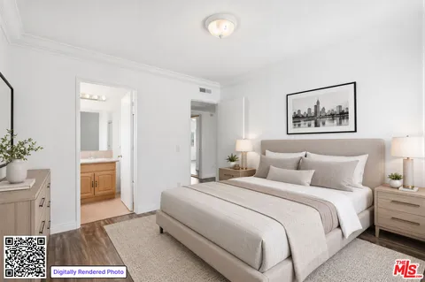 a bedroom with a bed and a view of bathroom