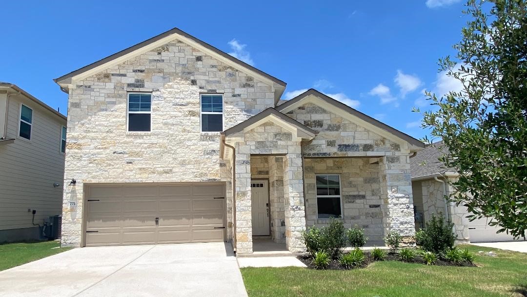 275 El Capitan Loop Dripping Springs, TX 78620 - Photo 1 of 1 a front view of a house with garden