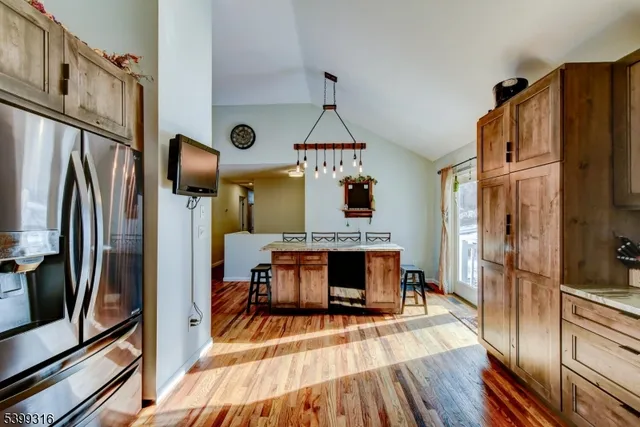 a view of living room with furniture and a fireplace