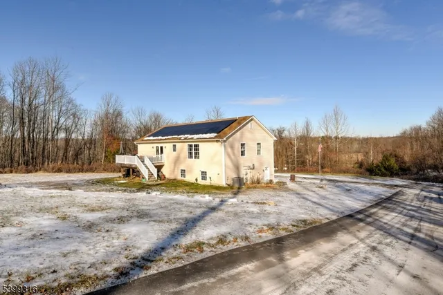 a view of a backyard of the house