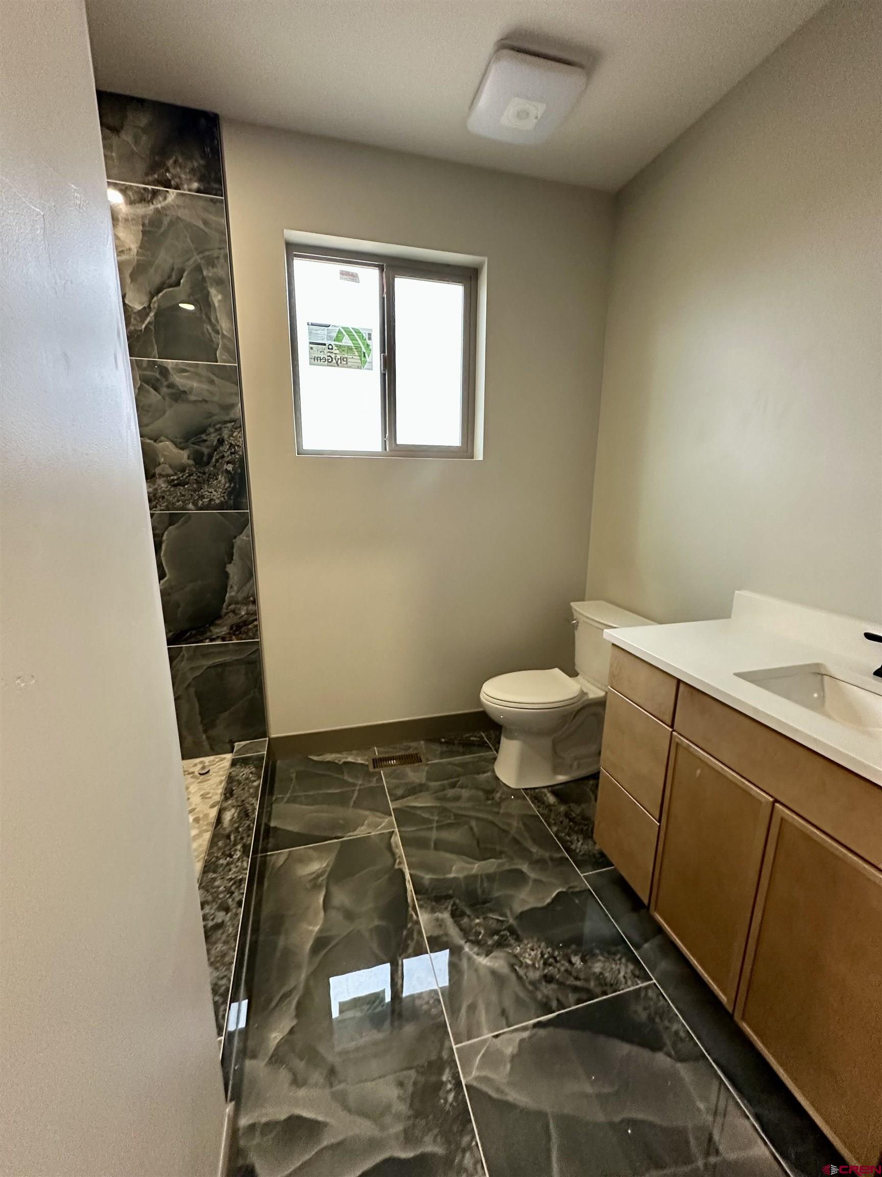 1526 Criterion Street Delta, CO 81416 - Photo 14 of 14 a bathroom with a sink and a toilet