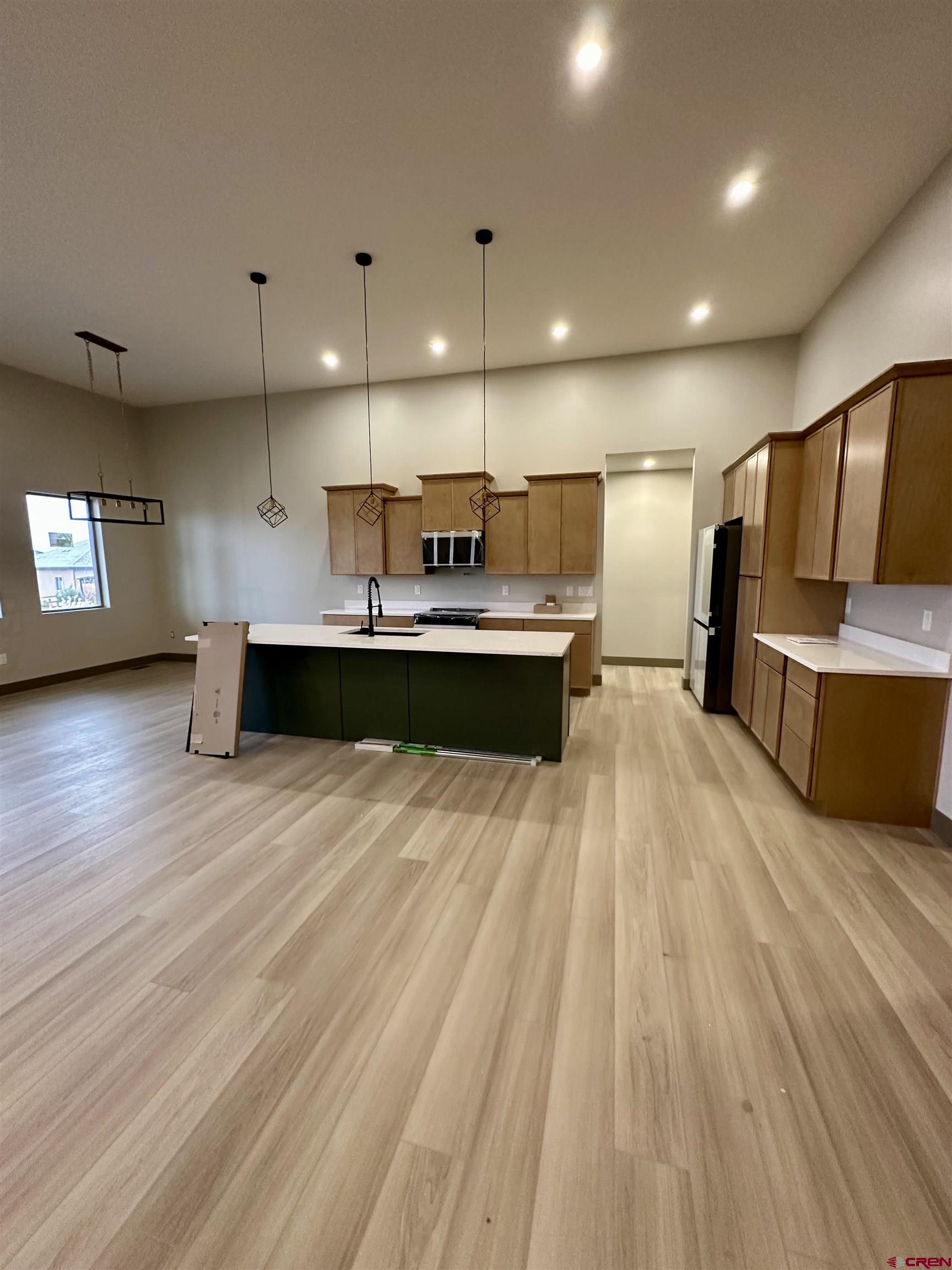 1526 Criterion Street Delta, CO 81416 - Photo 3 of 14 a view of kitchen with kitchen island a sink and wooden floor