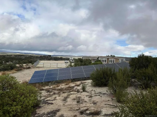 a yard with pier in back