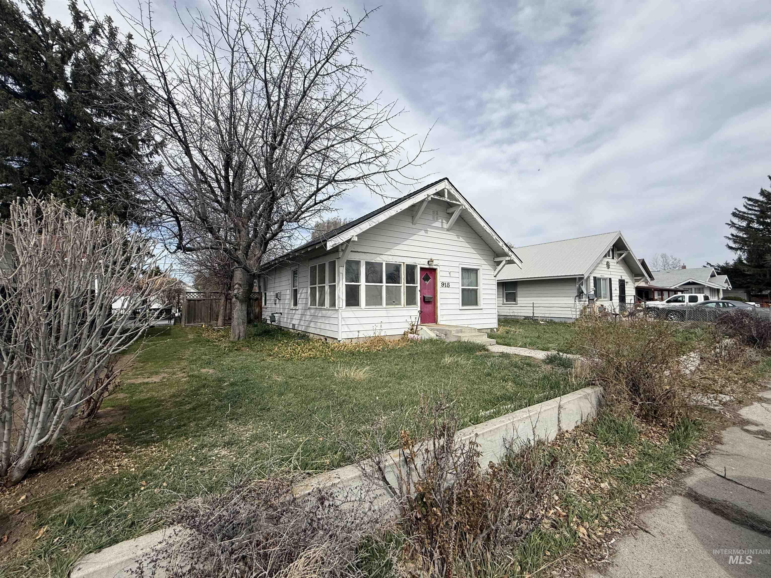 Bungalow-style home with a sunroom