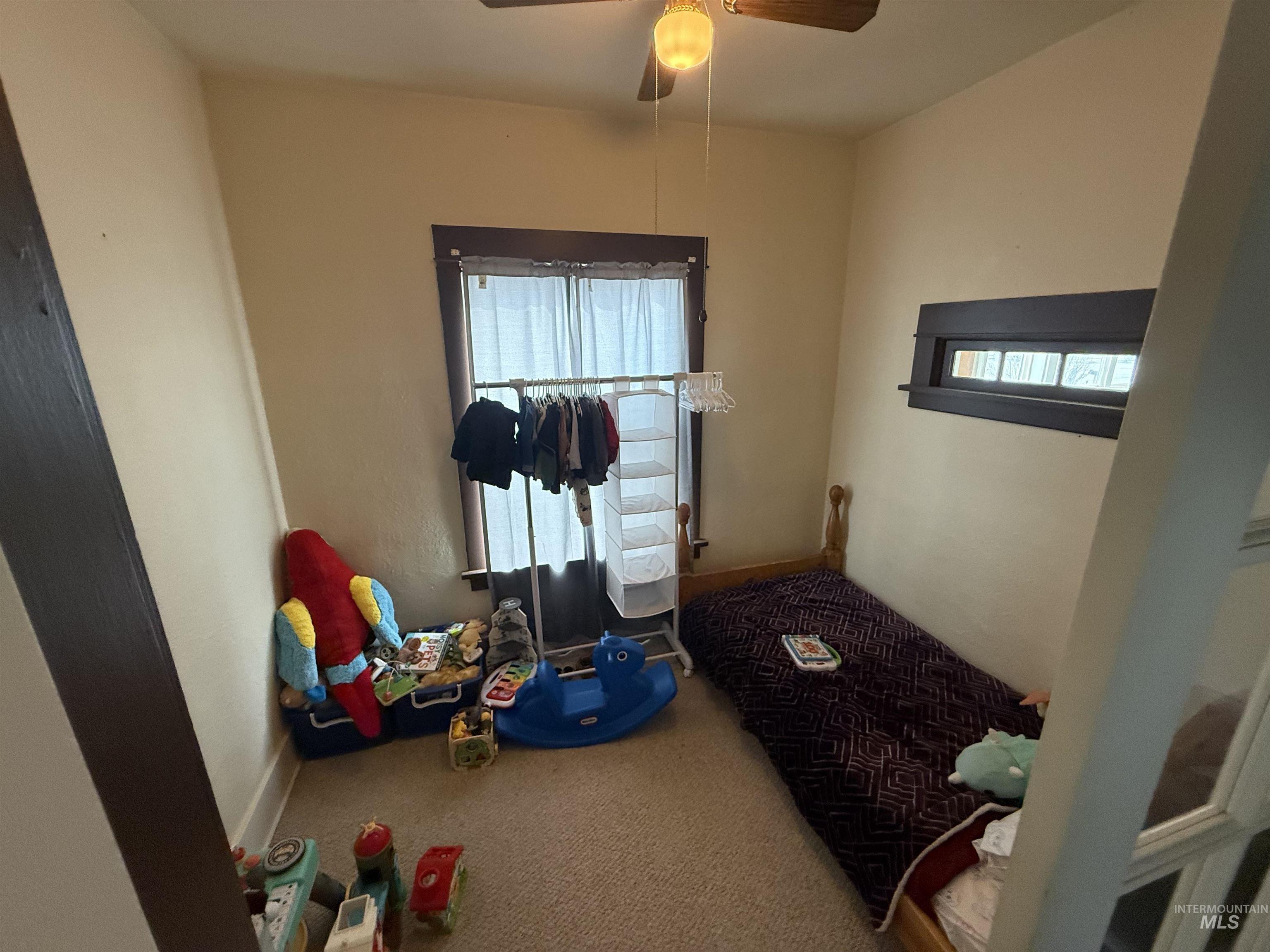 918 5th Street Rupert, ID 83350 - Photo 12 of 14 Recreation room featuring carpet floors and a ceiling fan
