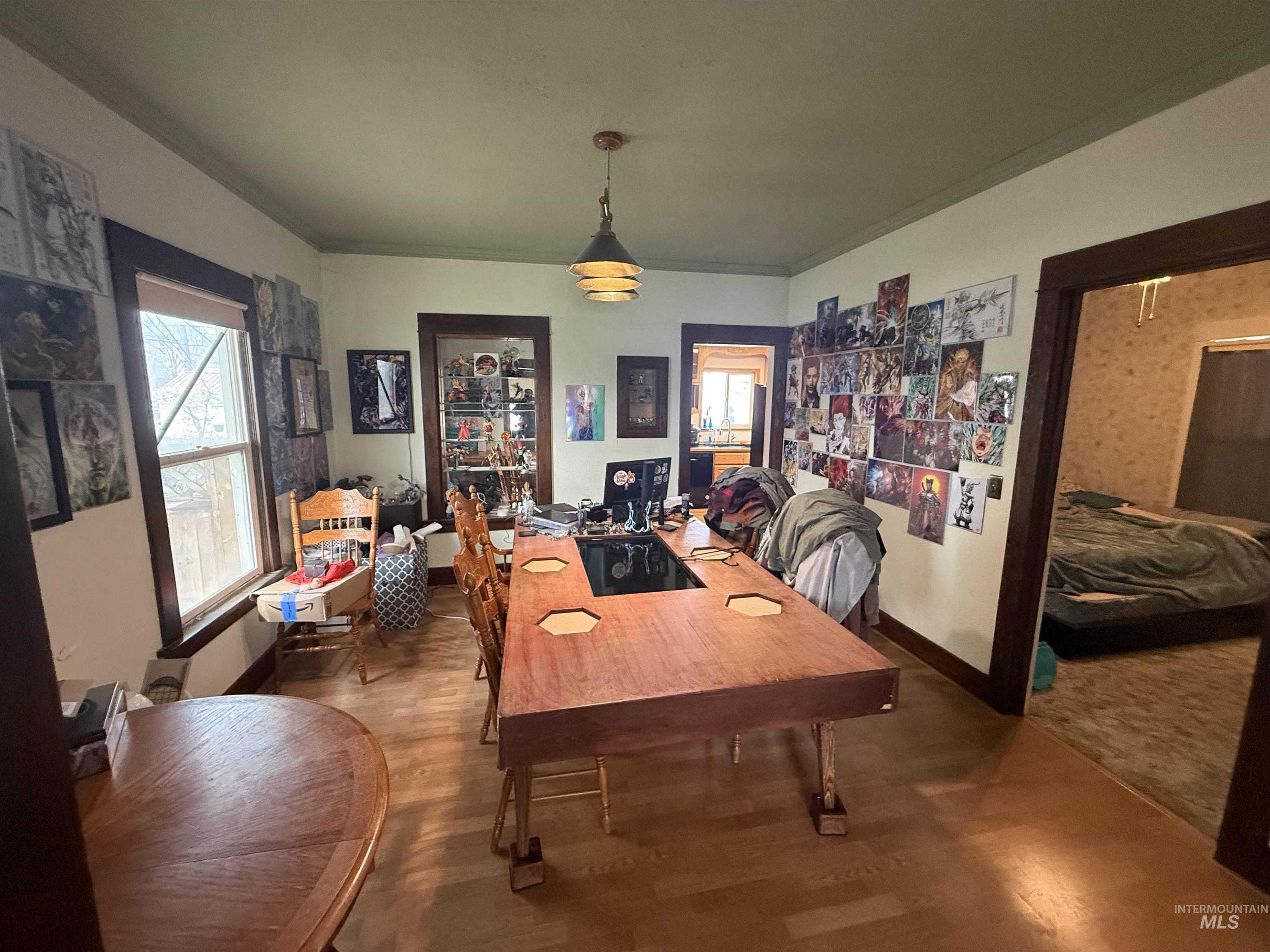 918 5th Street Rupert, ID 83350 - Photo 7 of 14 Dining area with wood finished floors and crown molding