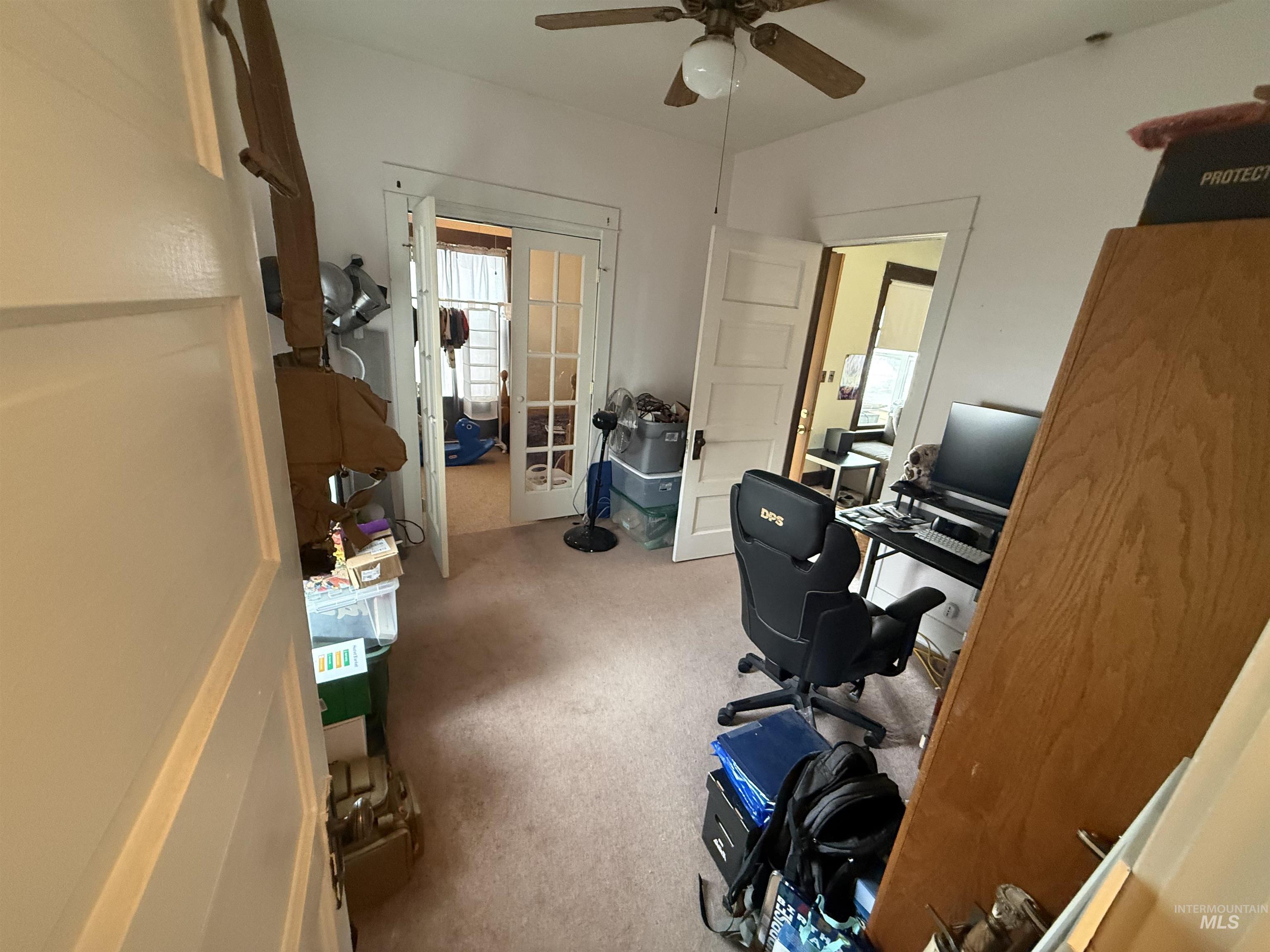 918 5th Street Rupert, ID 83350 - Photo 10 of 14 Office area featuring light colored carpet, a ceiling fan, and french doors