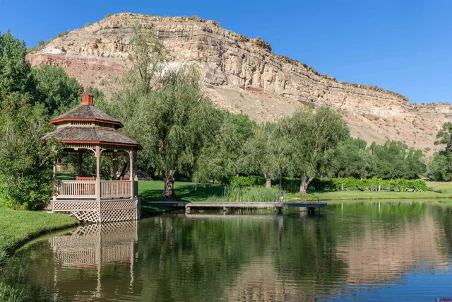 a view of a lake with a house in the background
