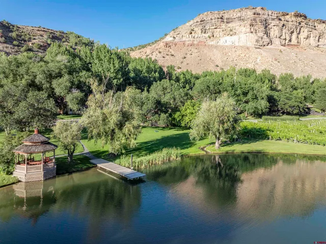 a view of a lake with big yard