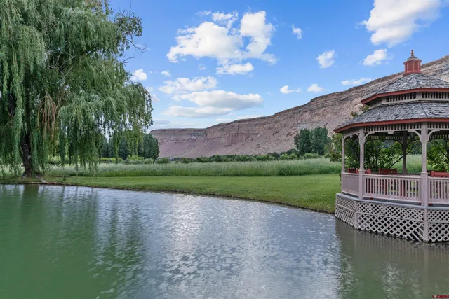 a view of a patio with a table & chairs