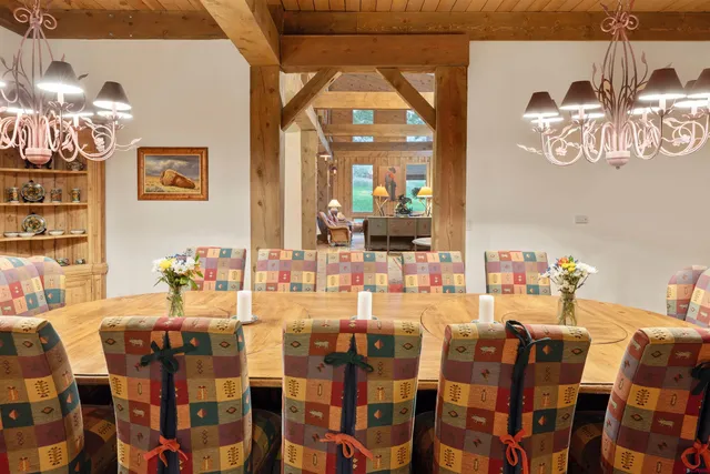 a view of a dining room with furniture and chandelier